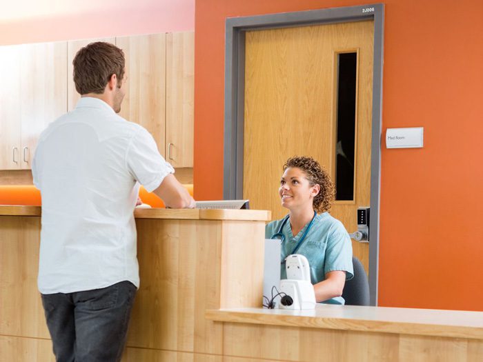 Partial Hospitalization and Inpatient Addiction Treatment - man at reception desk - mountain laurel recovery center