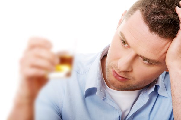 Relapse following Addiction Treatment - depressed man drinking - mountain laurel recovery center