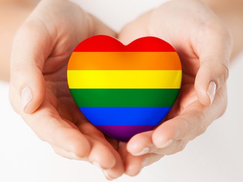 Recovery and the LGBTQ Community - hands holding rainbow heart