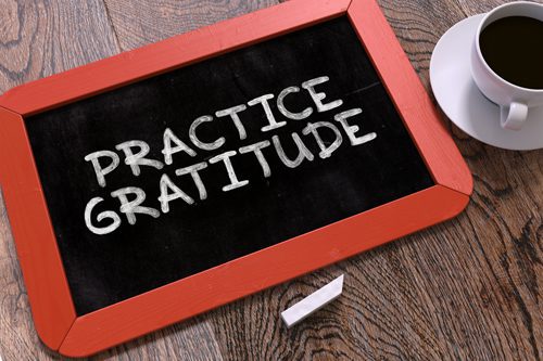 Practicing Gratitude in Recovery - practice gratitude written on a board