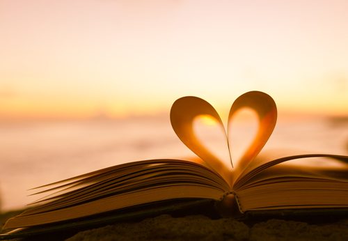Motivational-Books-for-Recovery - book pages making heart sunset