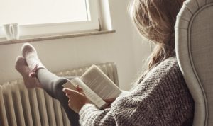 8-Ways-to-Manage-Stress-in-Recovery - woman in sweater reading book, 8 Ways to Manage Stress in Recovery, Manage Stress